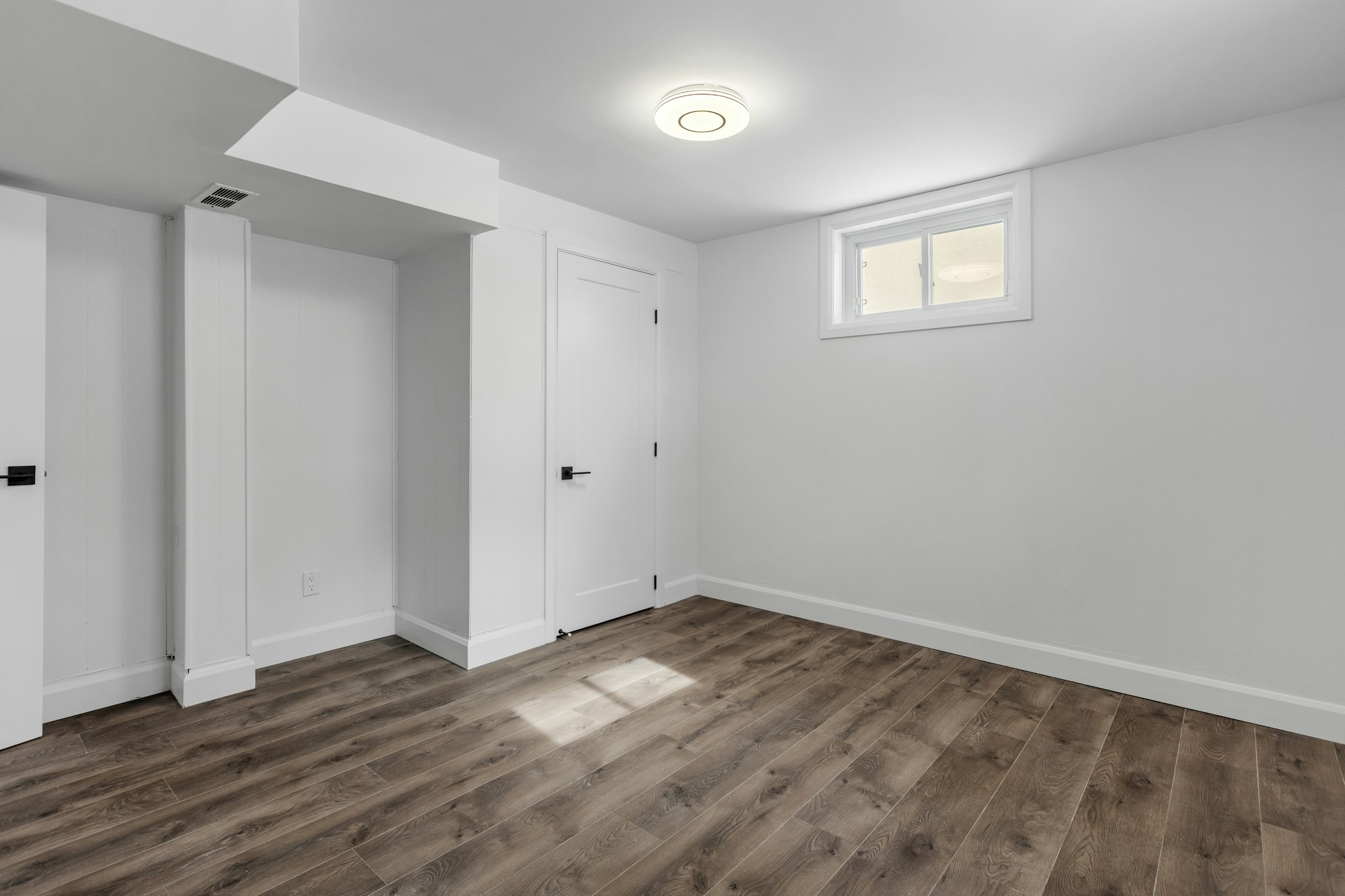 Clean empty room with wooden floor