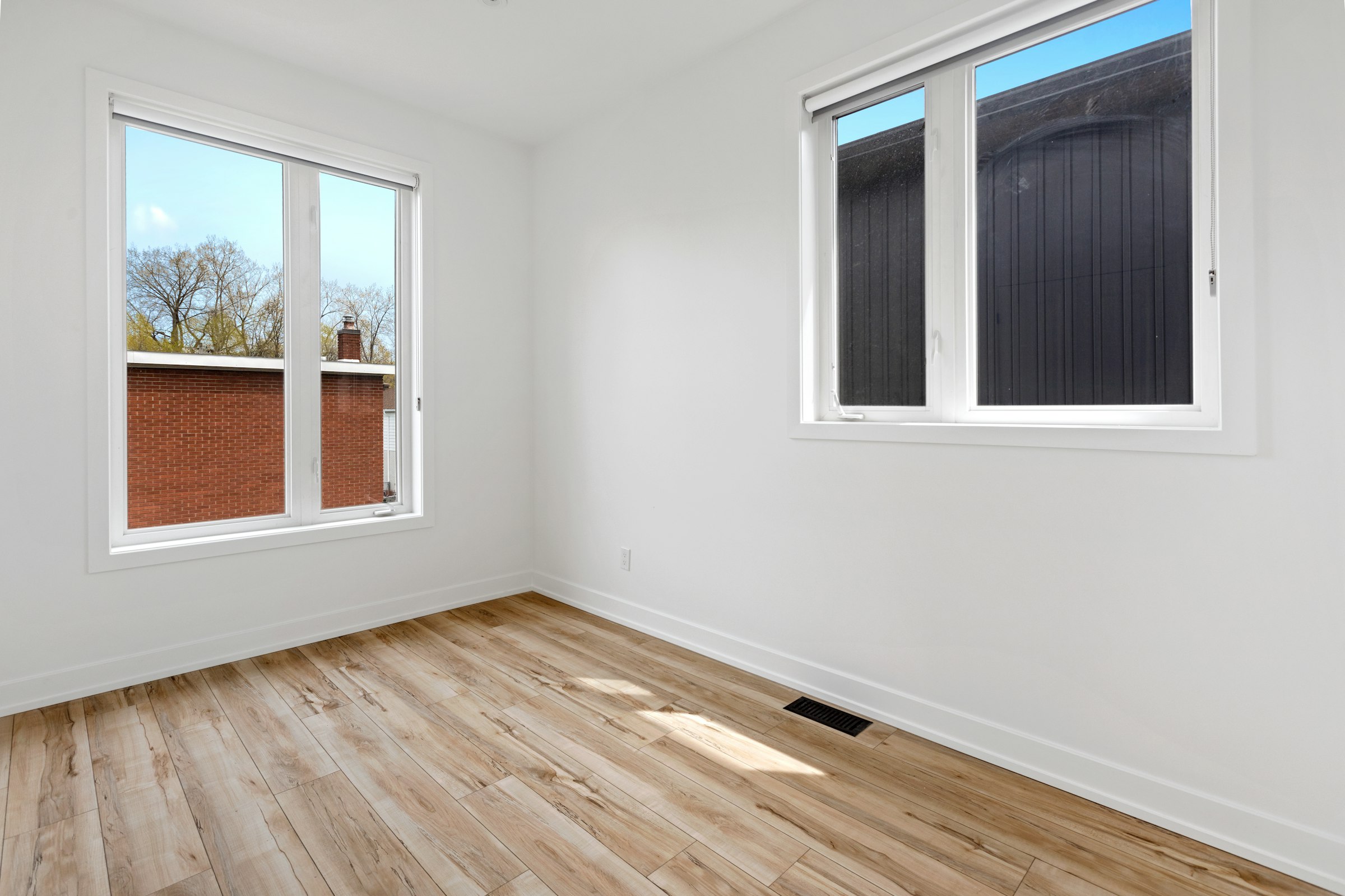Clean empty room with large windows