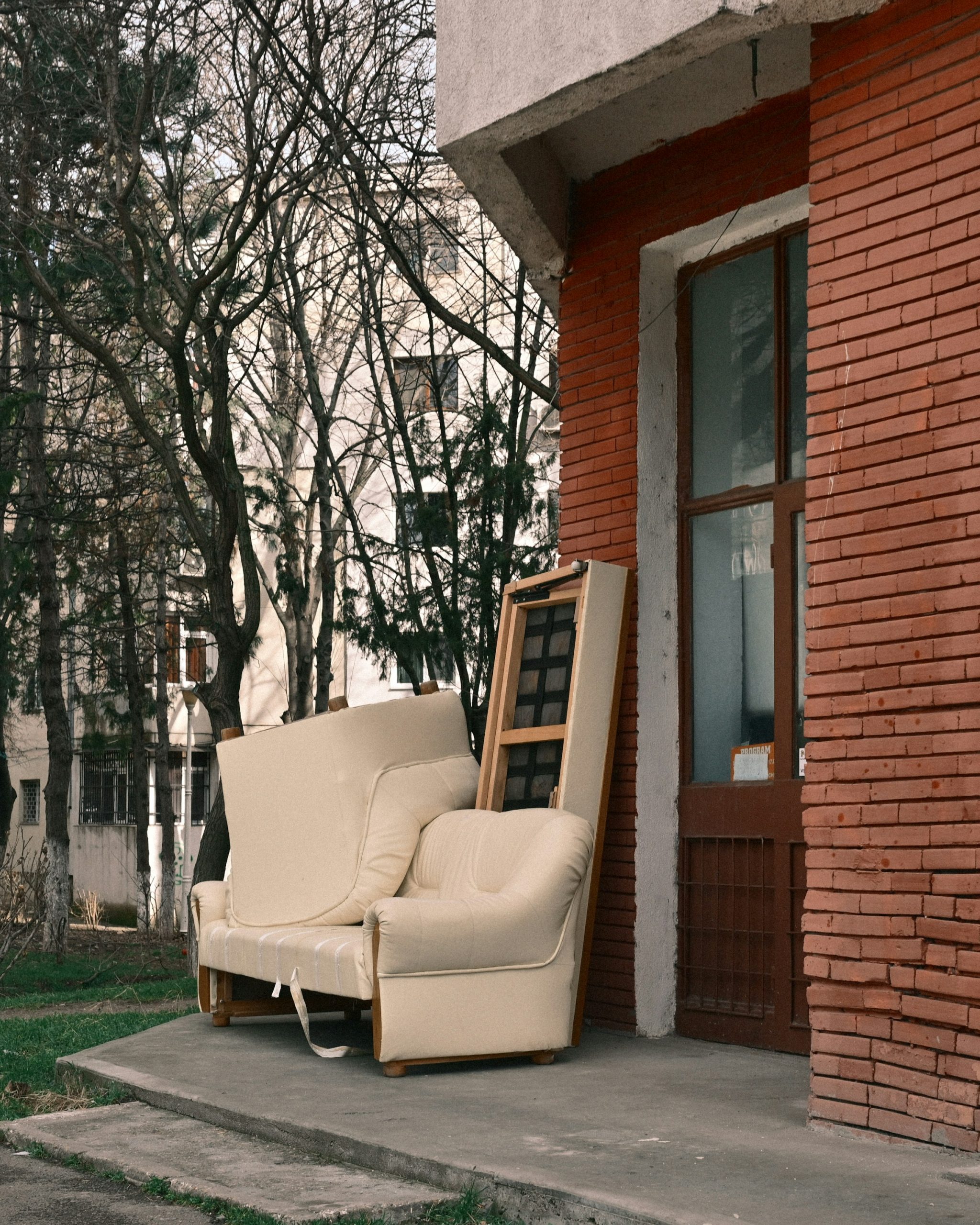 Old armchair and sofa left outside