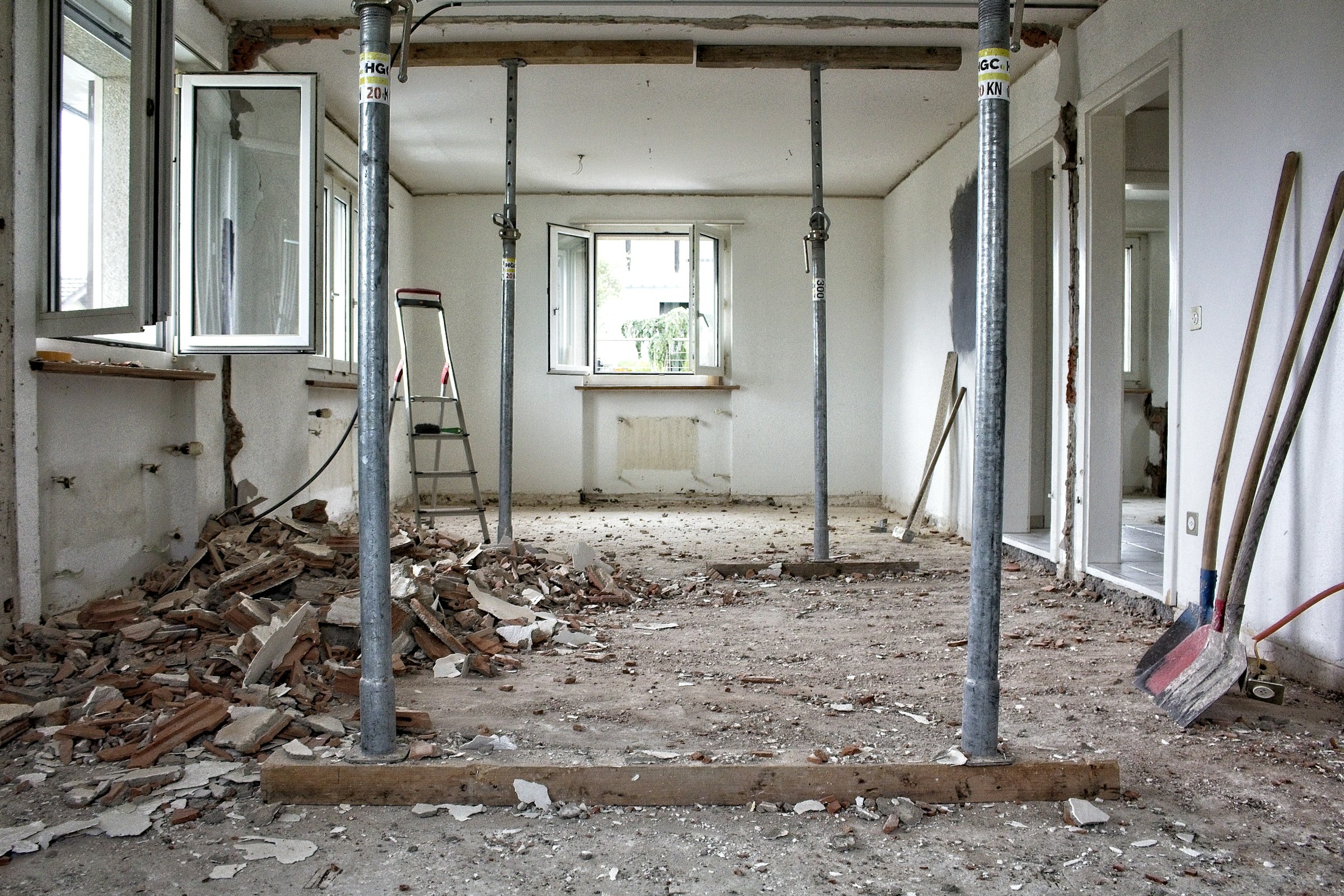 Room under renovation with building waste on the floor