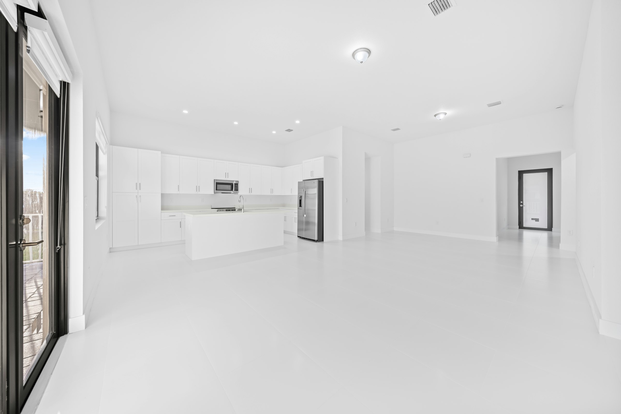 Bright empty modern kitchen and living room